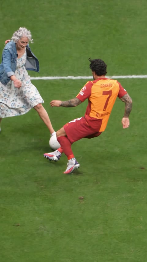 Sample 1: a grandmother in a denim jacket does the fake rabona past the defender