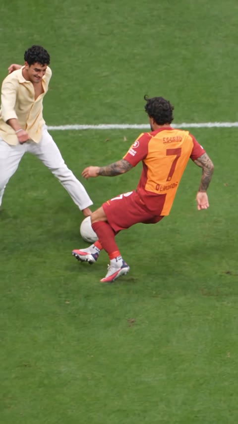 Sample 2: a young man in a cream shirt does the fake rabona past the defender